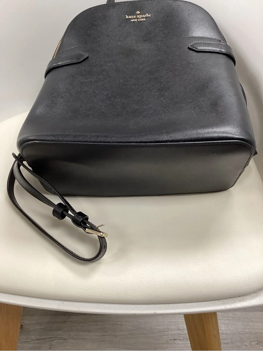 kate spade black leather backpack with gold logo